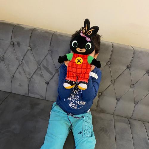 Child playing with Christmas goodies