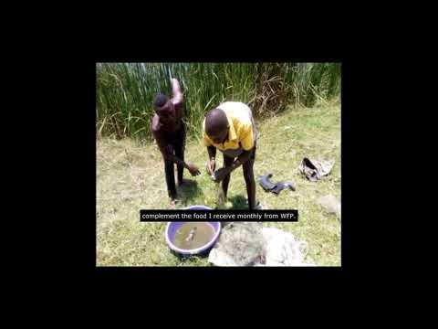 young refugee living in the Oruchinga Refugee Camp fishing