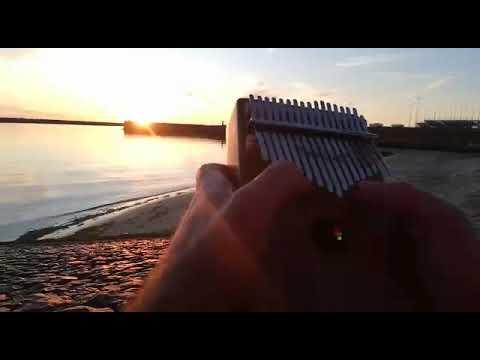 Playing Kalimba on the Beach