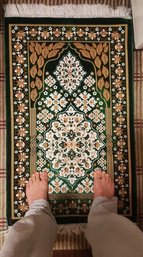 Image of feet of prayer mat