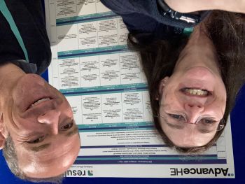 Fiona Aiken and Chris Hutton standing in front of their poster