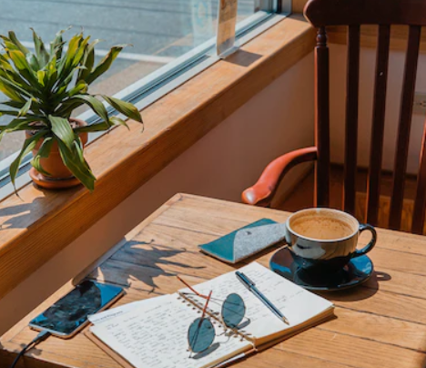 Notebook open in a cafe