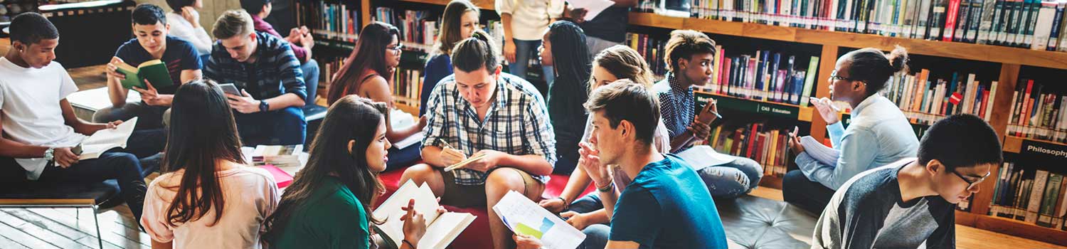 a group of students working collaboratively in a library setting