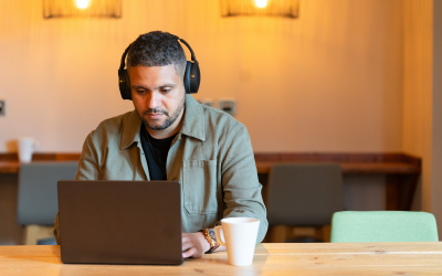 Man had laptop listening to headphones