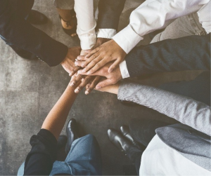 many hands joint together