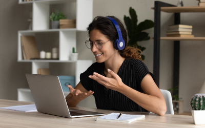 Woman on laptop taking part in an online tutorial