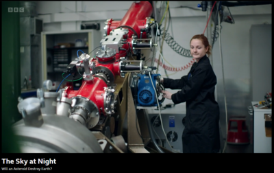 Dr Zoe Emerland rotating the AALGG between horizontal and vertical orientation to demonstrate vertical momentum transfer experiments in preparation for missions DART and HERA