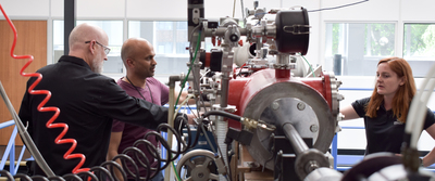 Prof. Manish Patel, Dr Matthew Sylvest and Dr Zoe Emerland discussing experiments by the AALGG small chamber