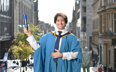 OU graduate Duncan Wright outside Glasgow Royal Concert Hall.