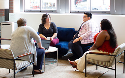 A group of seated people chatting