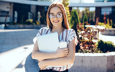 Woman standing outside workplace