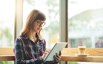 A woman looking at an iPad