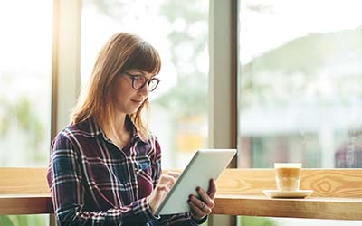 Photo of female with iPad