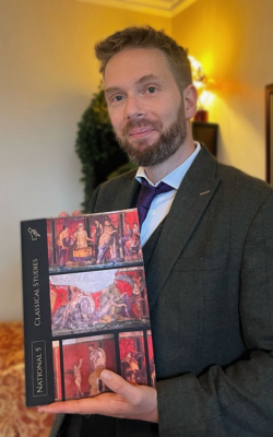 OU graduate George Connor, holding his Classical Studies book