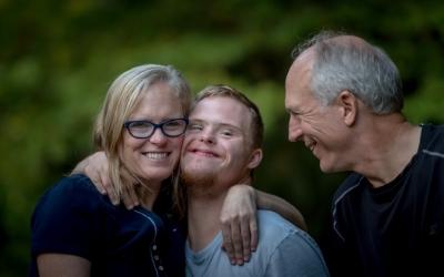 Three smiling people