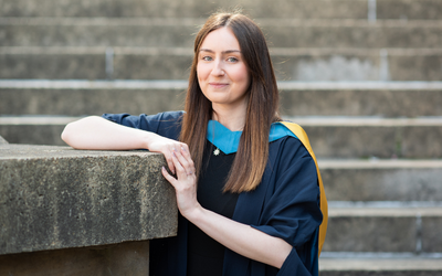 OU graduate Jade Taylor, pictured in her graduation gown