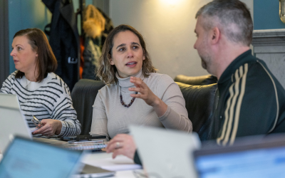 Staff members from Winning Scotland in a meeting