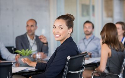 Business people seated round a table for a meeting