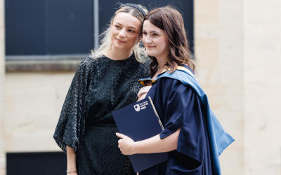 An OU graduate posing with a family member