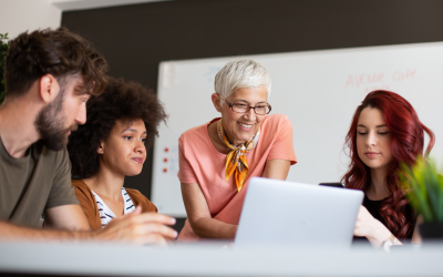 Four colleagues working together on a project