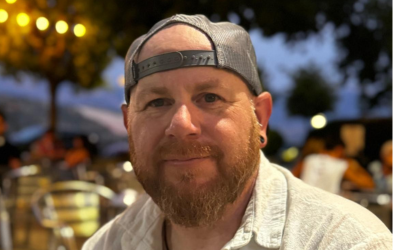 Colin Mutch wearing a baseball cap backwards 