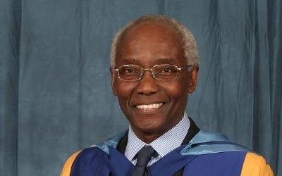 Prof Sir Geoff Palmer CD wearing his OU honorary graduate robes