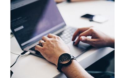 Hands on laptop keyboard