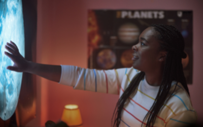 Student reaching out towards portal in poster