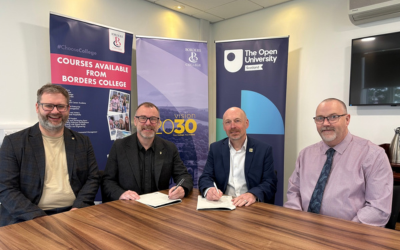 Pictured seated at a table, in front of Borders College and Open University in Scotland pop-up banners: Richard McConnell, OU in Scotland Senior Partnerships Manager - Education Pathways; Martin Boyle, OU in Scotland Principal; Pete Smith, Borders College Principal and Chief Executive; Davie Lowe, Border College Assistant Principal.