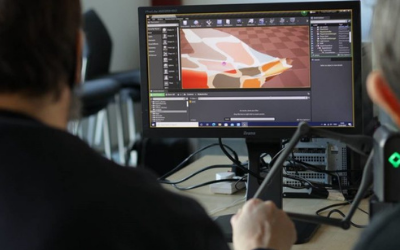 Photo of people working on a computer 