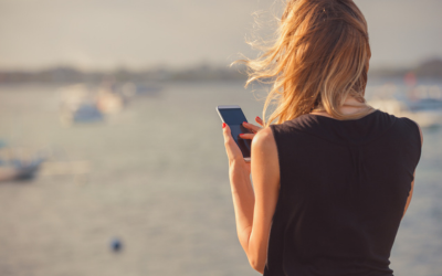 Photo of a person holding a smart phone. 