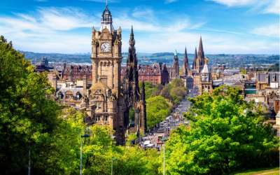 A view of Edinburgh from Calton Hill towards Princes Street, with trees in the foreground. 