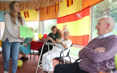 Photo of older people learning languages. 