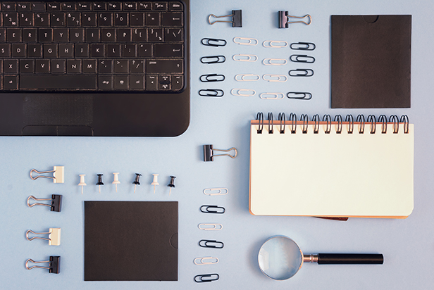 A table topped with lots of office supplies
