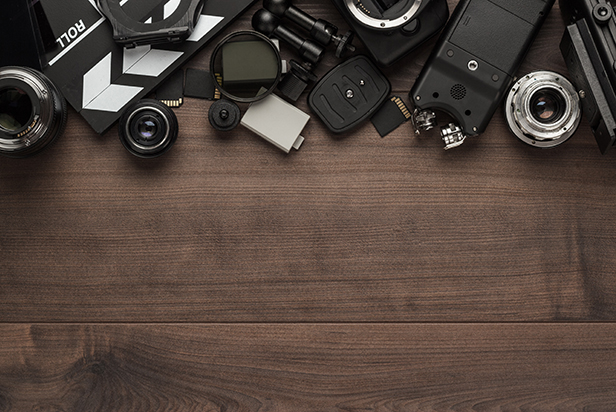 Different video making equipment on brown wooden table with copy space indie movie production essentials