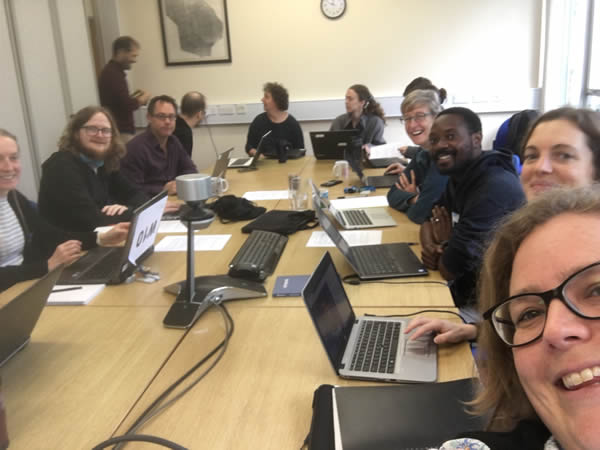 Staff working together around a table
