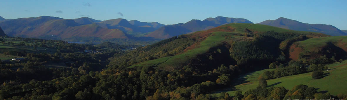 Green valley with mountains in the distance