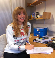 Mairi Walker sitting at desk