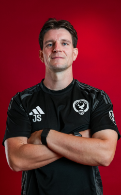 Jack wearing his football coaching kit