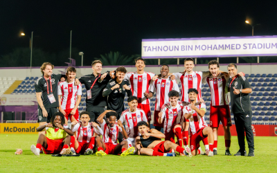 Jack with the football team he coaches in the UAE