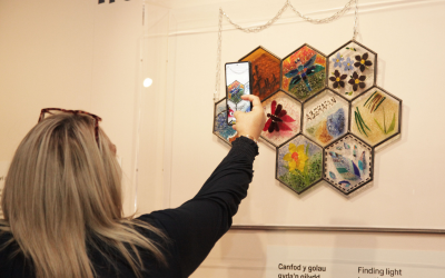 Jen taking a picture of her art