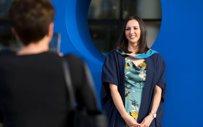  An OU graduate having their photo taken at a graduation ceremony