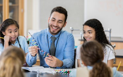 Teacher showing DNA model to students