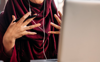 Student at a computer wearing earphones