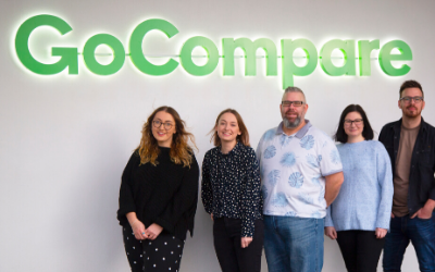 Students next to the GoCompare logo