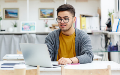 Male Open University student at laptop