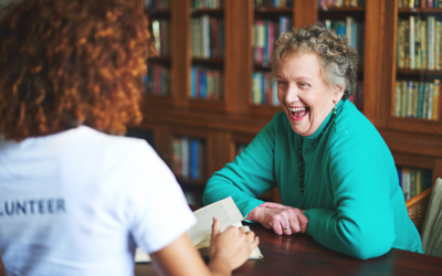 Woman laughing with carer