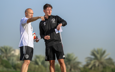 Jack coaching football with Iniesta