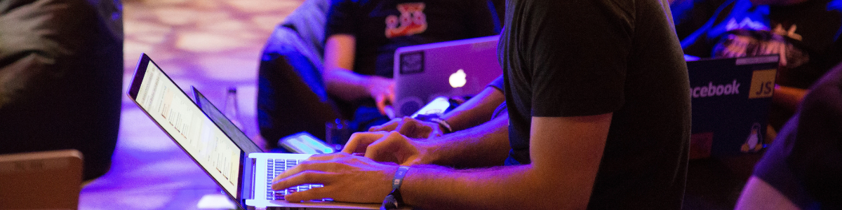 Student on a laptop in a hall